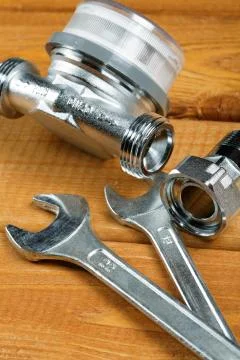 Wrenches with bolts on a desktop Close-up Stock Photos