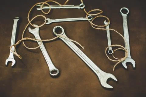 Wrenches on a brown background Stock Photos