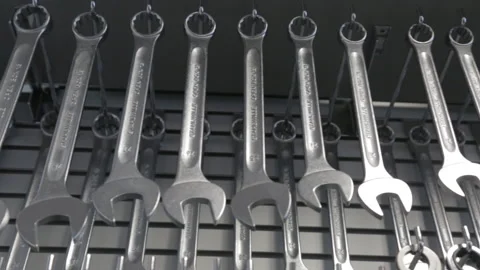 Wrenches of different sizes hanging slider shot Stock Footage 138037439