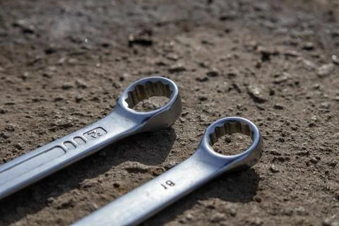 Wrenches on the Ground Waiting for Use After a Repair Session in a Workshop.. Stock Photos