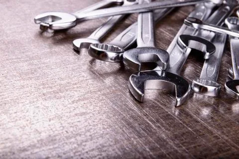 Wrenches on a metal background Stock Photos