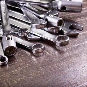 Wrenches on a metal background Stock Photos