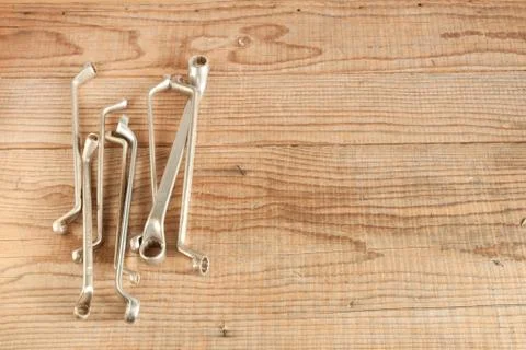 Wrenches set on wood background Stock Photos