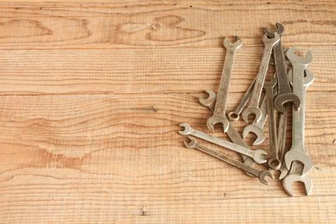 Wrenches set on wood background Stock Photos