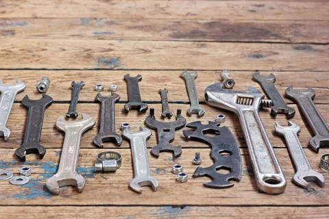 Wrenches on a timber floor, the top view. Stock Photos