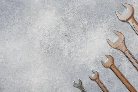 Wrenches, tools on gray concrete background with copy space. 写真素材