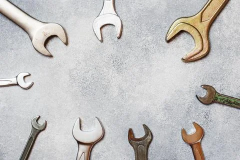 Wrenches, tools on gray concrete background with copy space. 스톡 사진