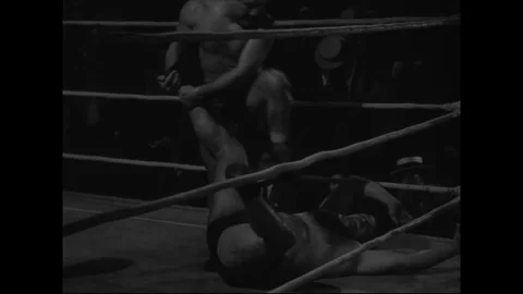 Wrestling match in progress, crowd cheering - 1942-1947 Video stock 86433980