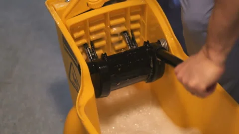 Wringing Out Mop in Bucket Video stock 236707852