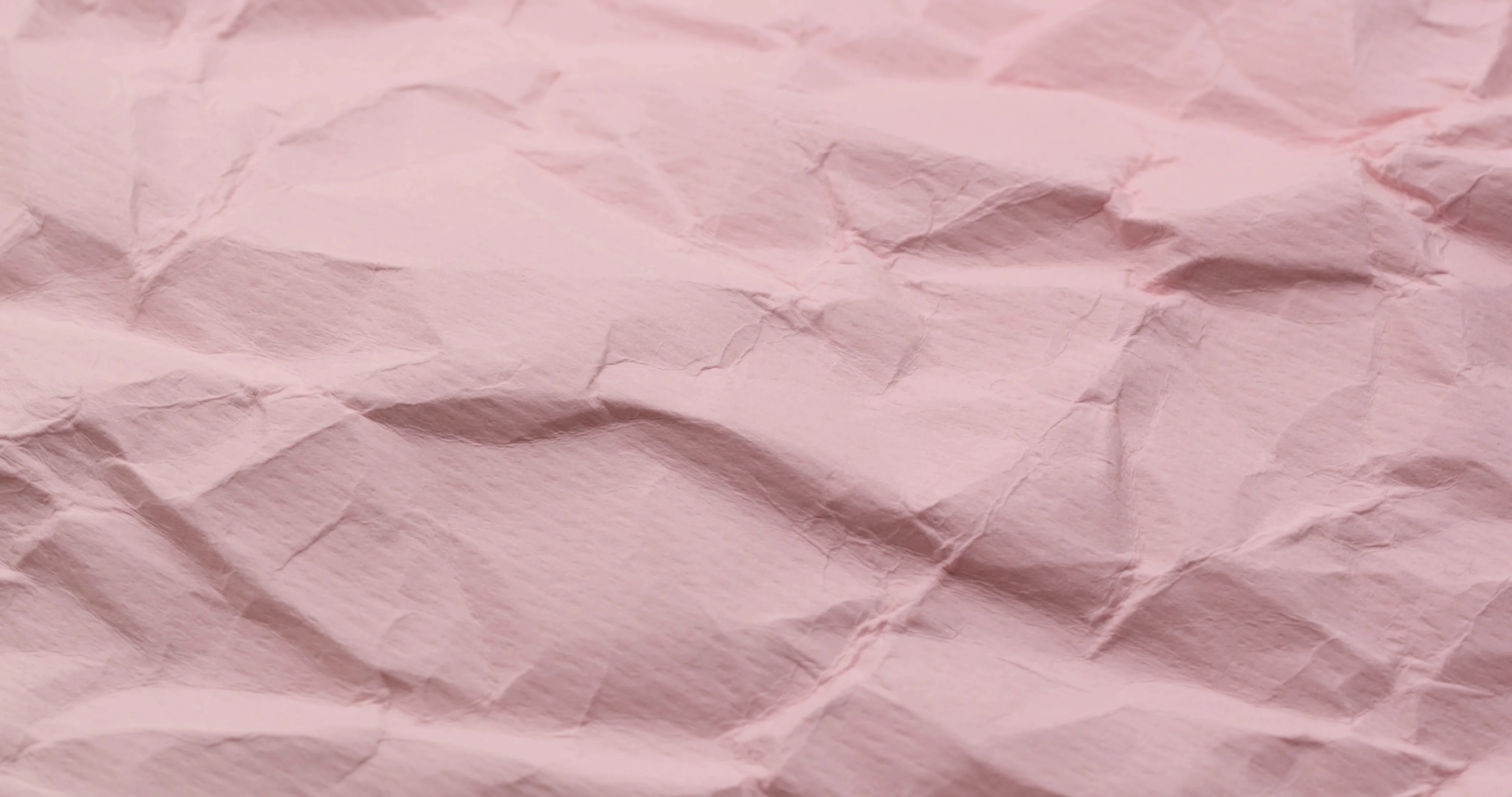 Wrinkle pink paper texture in rotation, Stock Video