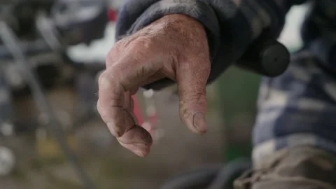The wrinkled hand of an old man on the control stick of a motor boat Stock Footage 237454893