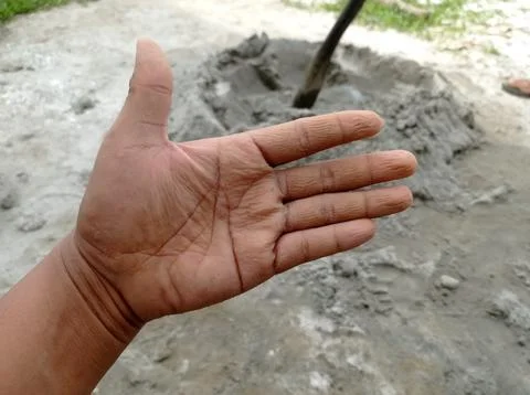 The wrinkled left hand of a construction worker Stock Photos
