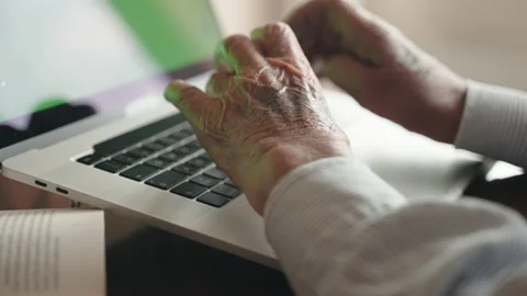 Wrinkled man hands typing on trendy laptop keyboard, senior man working at home Stock Footage 164053907