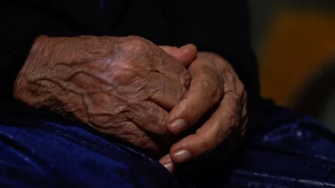 The Wrinkled Old Tired Hands Of An Elderly woman Stock Footage 256400231