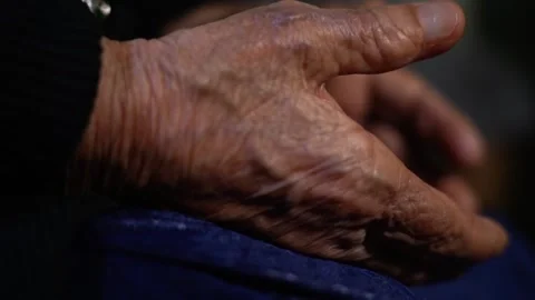 The Wrinkled Old Tired Hands Of An Elderly woman Video stock 256400248