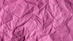 Wrinkle pink paper texture in rotation, Stock Video