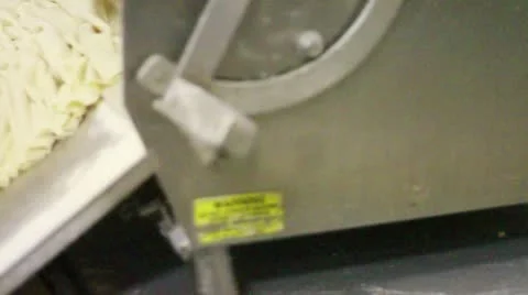 Wrinkling dough with machine pan left Stock Footage 9434487