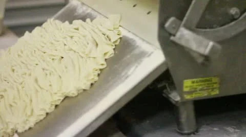Wrinkling dough with machine pan left 2 Stock Footage 9434742
