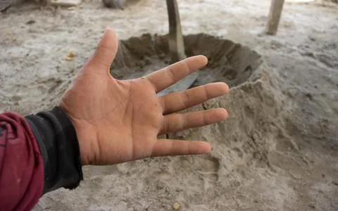 Wrinkly hands of construction workers. Stock Photos