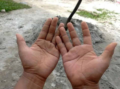 Wrinkly hands of construction workers. Stock Photos