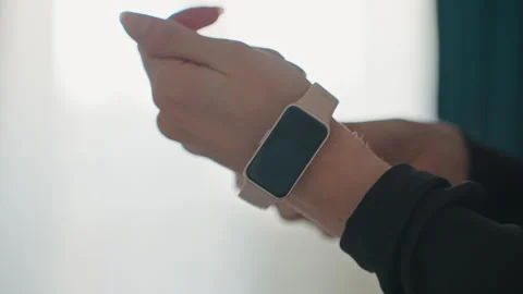 Wrist adjustment before exercise. Quiet mood during fitness routine setup Stock Footage 342421237