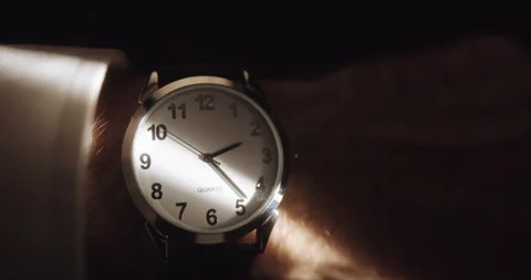 Wrist Watch in Sliver of Light Stock Footage 220682556