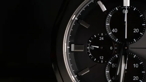 Wrist watch time lapse close up on black background. Video stock 108985342