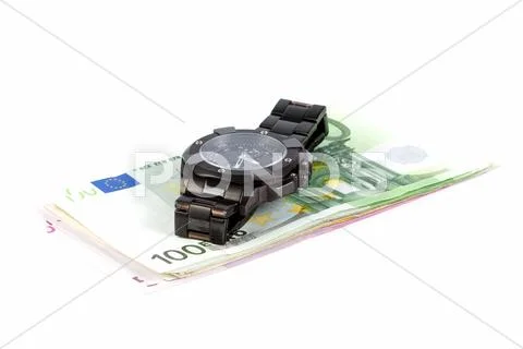 Wristwatch and euros Stock Photos