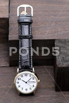 Wristwatch with leather strap Stock Photos