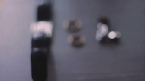 Wristwatches, Rings and Two Studs on the Table Stock Footage 62771237