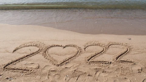 Write 2022 on beach Stock Footage 167785573