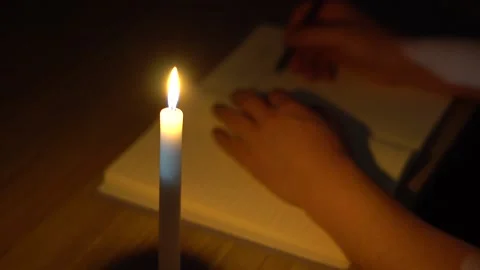 Write and read by candle light at night2 Stock Footage 156281157