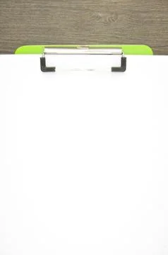 Write blank paper clip on green clipboard Stock Photos