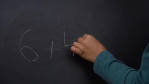 Write calculation task on blackboard Stock-Footage 94180239