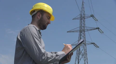 Write on clipboard engineer at electric high pole, notes and study case, working Video stock 41392587