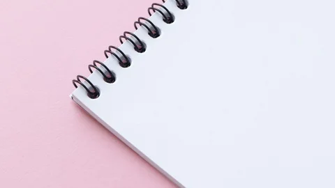 Write Happy New Year on white notepad paper. Female hand do congratulatory Vídeos de archivo 129204899