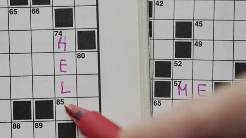 Write HELP  ME on crossword puzzle Stock Footage 311129674