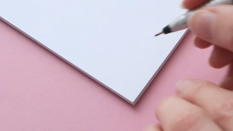 Write love you on white notepad paper. Female hand leave note or letter Stock Footage 129199357