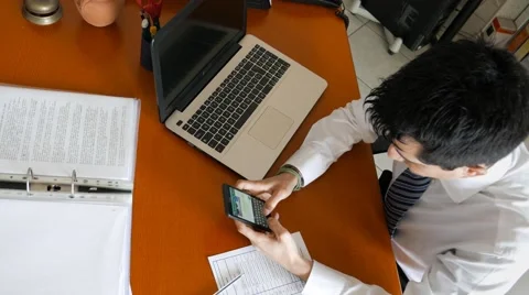 Write messages on a cell phone instead of working Stock Footage 60692741