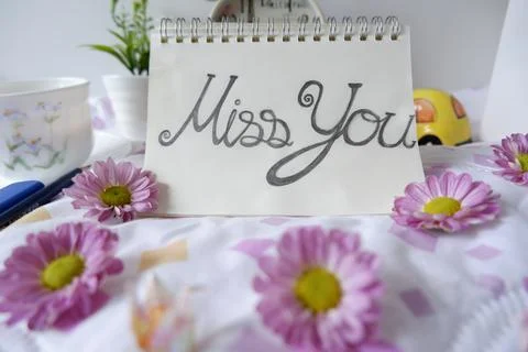 Write nostalgia on white note paper with beautiful lettering Stock Photos