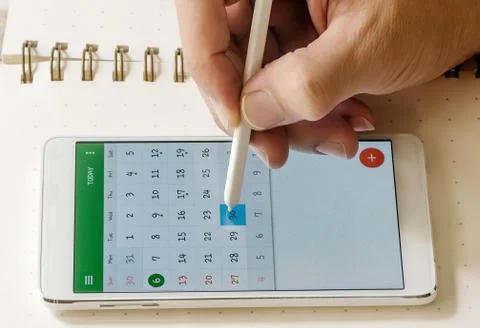 Write note on phone Stock Photos