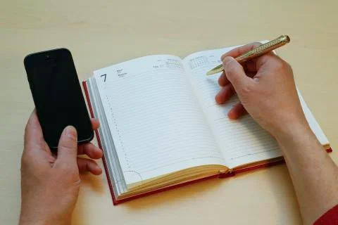 Write to a notebook from your phone Stock Photos
