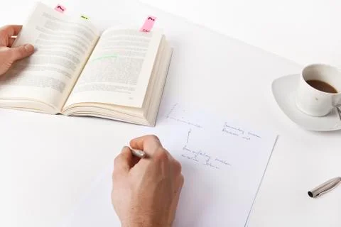Write notes from a book Stock Photos