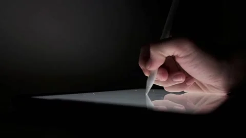 Write pen on the ipad at night Stock Footage 149314931
