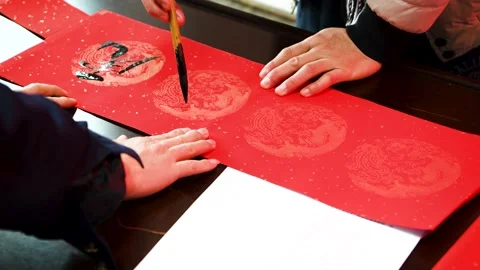 Write Spring Festival couplets during the Chinese Spring Festival Stock Footage 168729469