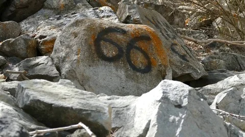 Write text and numbers on rocks, 動画素材 101350894
