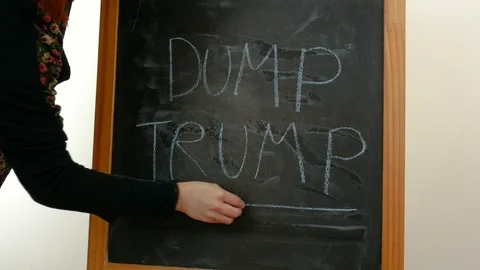 The write "Trump dump" on a blackboard Stock Footage 86468688