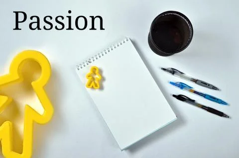 Write your passion on white notebook, using blue or black pens Stock Photos