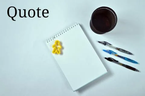 Write your quote on white notebook, using blue or black pens Stock Photos