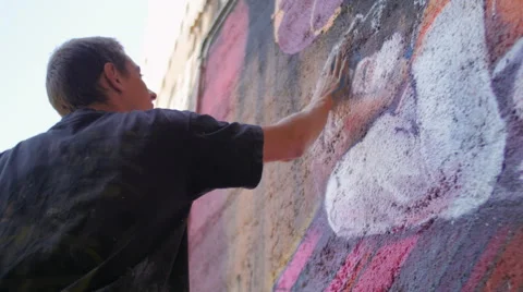 Writer adjusting details on the wall with hands Stock Footage 58630586